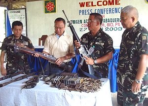 Guns and ammunitions surrendered by NPA members to the army