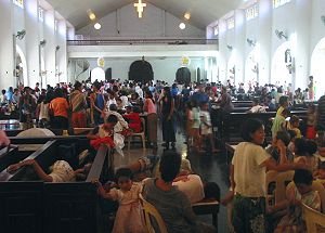 Catarman flood evacuees taking shelter at the Catarman Cathedral photo
